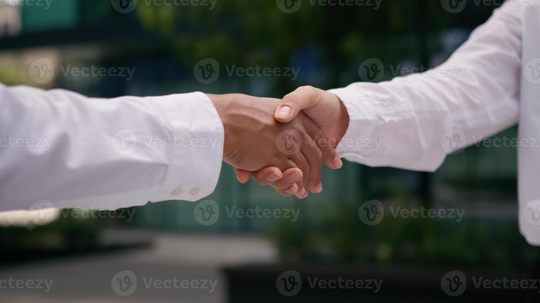 Close up business partners hands handshake businesspeople deal successful agreement cooperation team negotiation client collaboration meeting greeting interaction communicate trust contract colleague photo