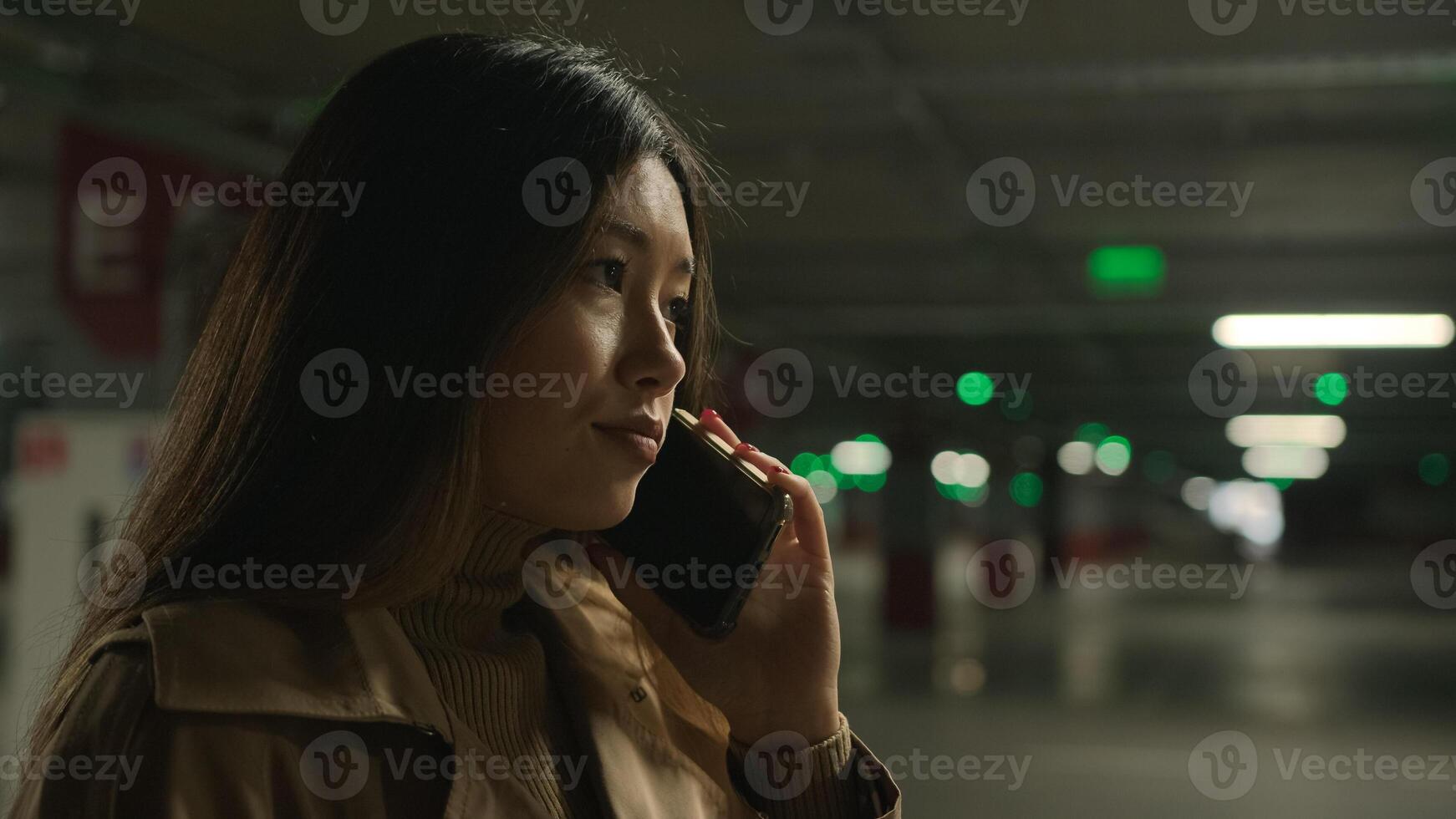 Worried upset Asian woman talk mobile phone in parking call worried talking disappointed smartphone conversation business problem chinese korean girl speak worry dissatisfied stressed trouble bad news photo