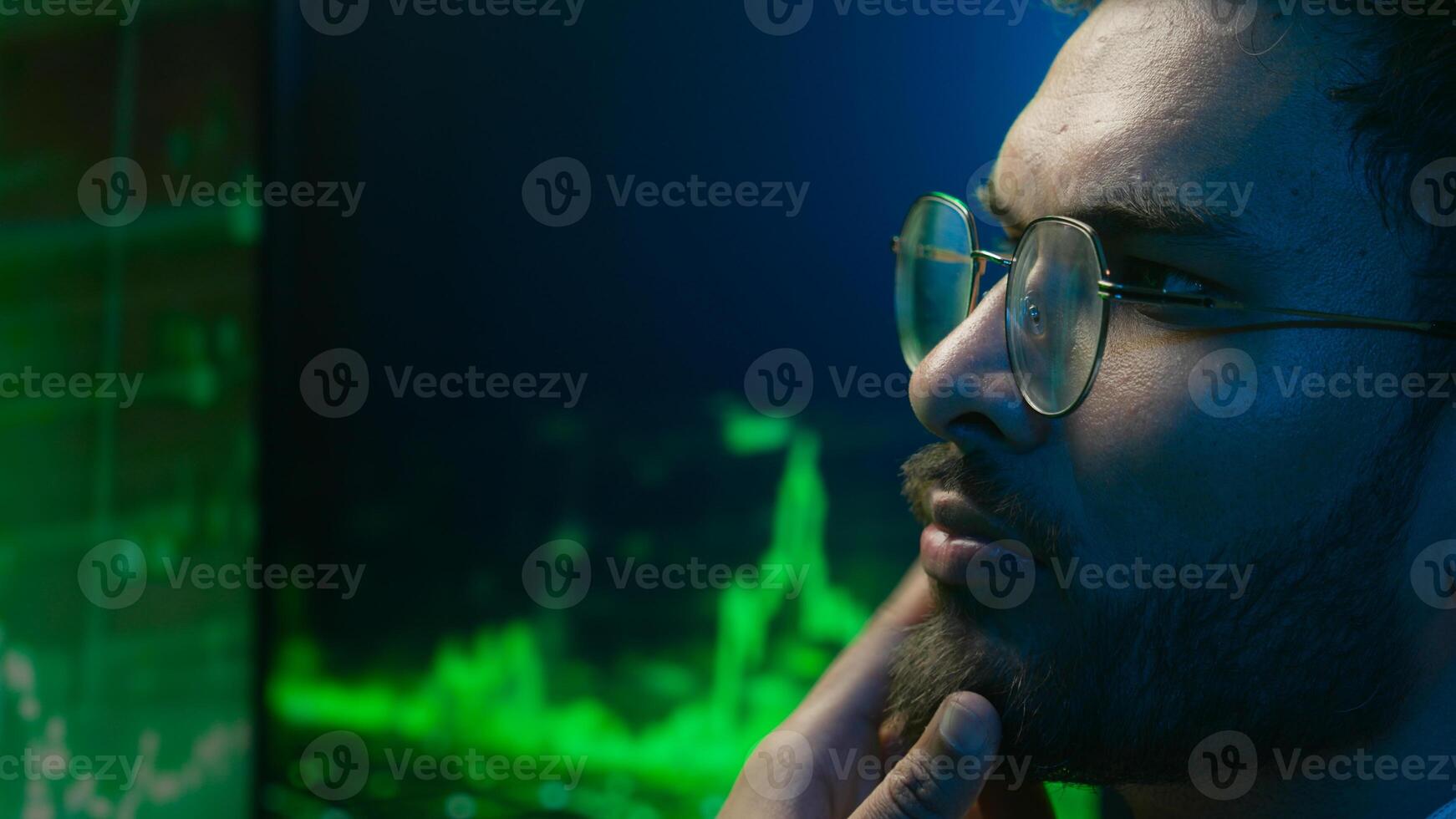 Indian Arabian man programmer hacker thinking looking computer chart guy trader analysis trading crypto currency database male technology IT specialist thoughtful coder monitor finance brainstorming photo