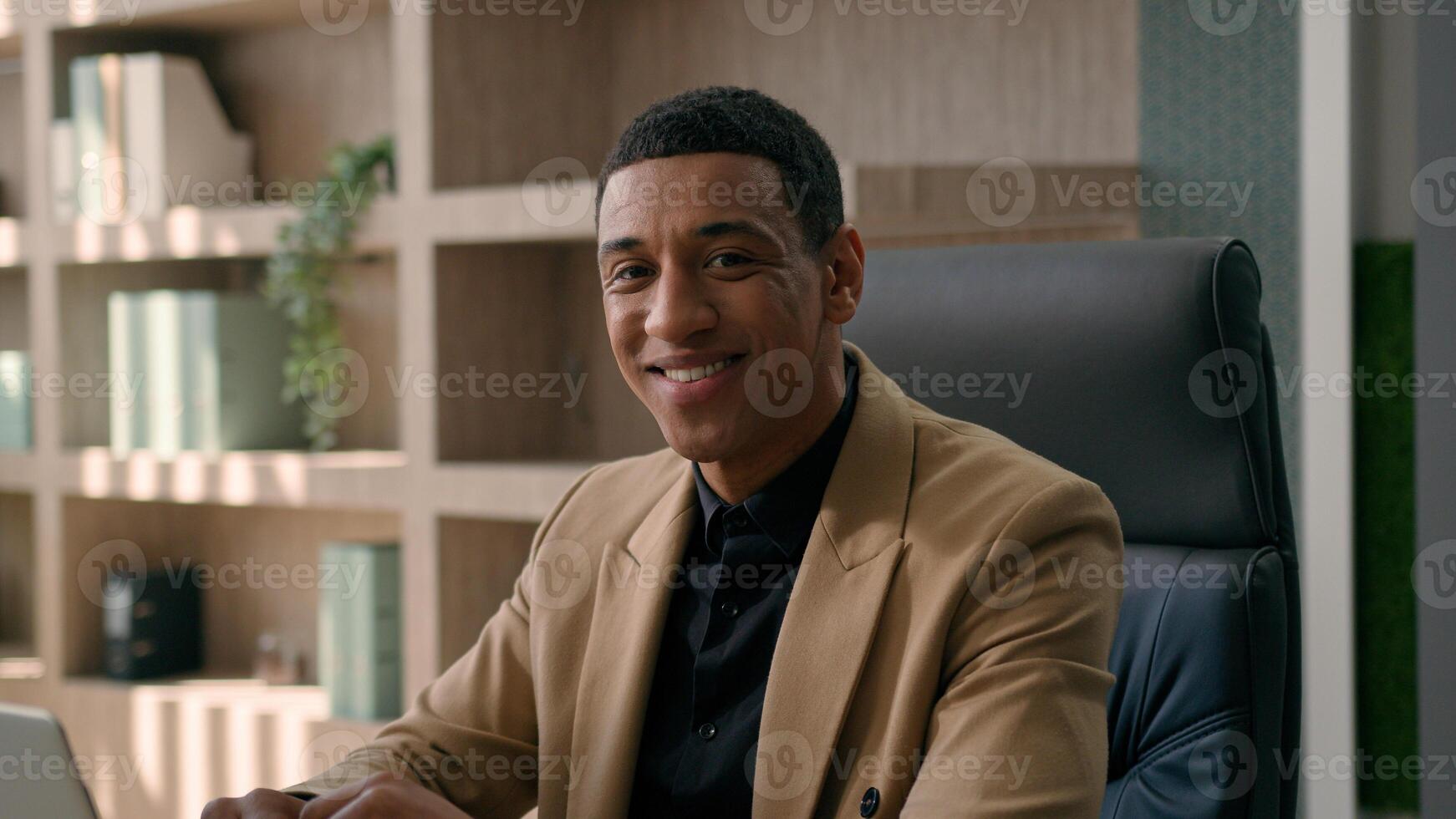 Business portrait African American man male smiling businessman ethnic satisfied entrepreneur office employer ceo director HR manager leader executive worker looking at camera toothy smile moving shot photo