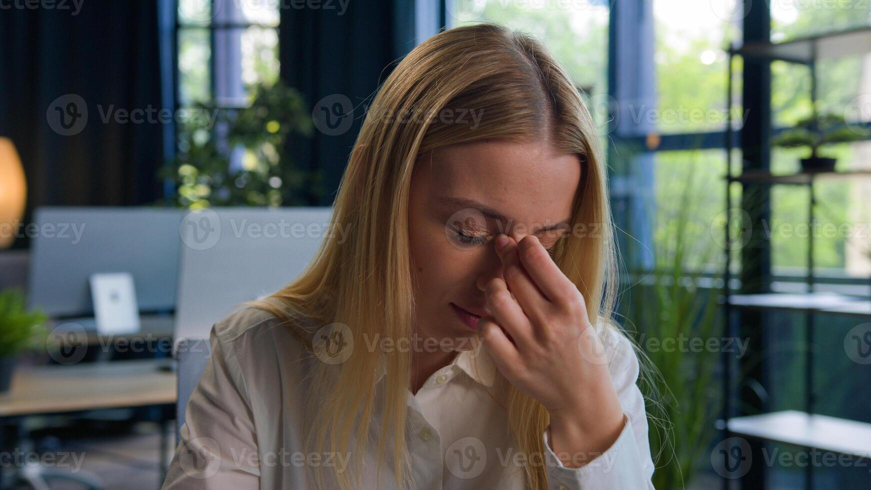 Tired Caucasian woman employer student feel pain eyestrain eyes discomfort after computer online business work in office exhausted overworked businesswoman girl headache pain ache bad vision eyesight photo