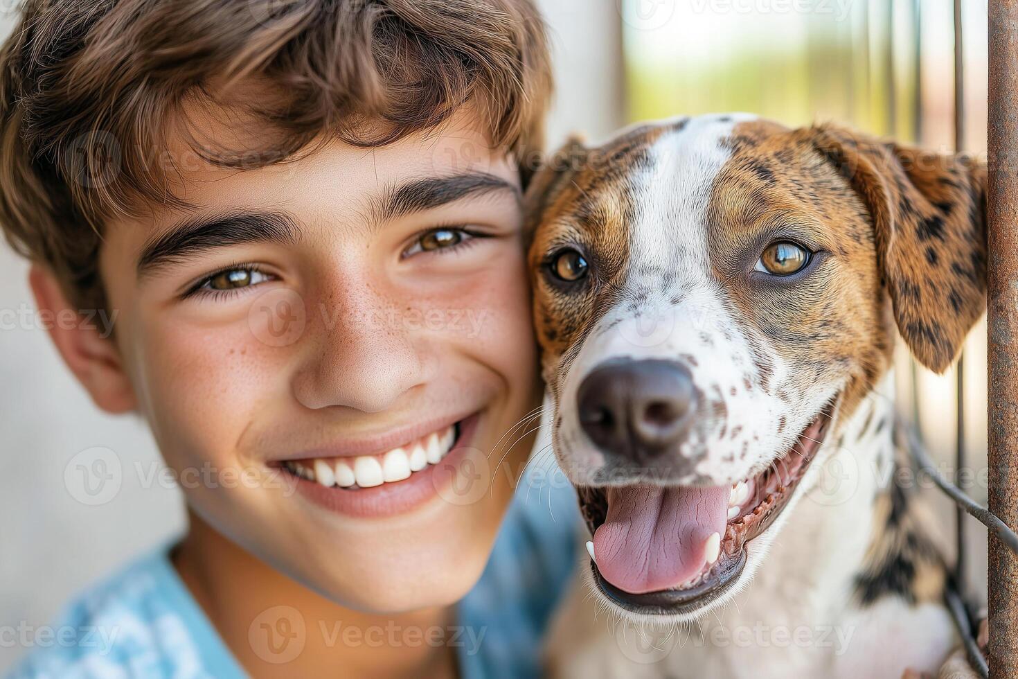 Boy with a shelter dog in hands photo