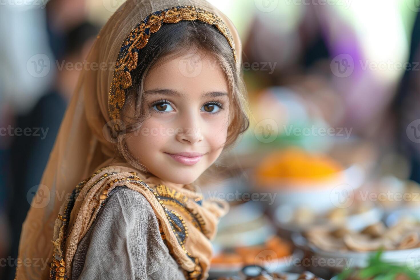 A little girl in a headscarf at a buffet table photo