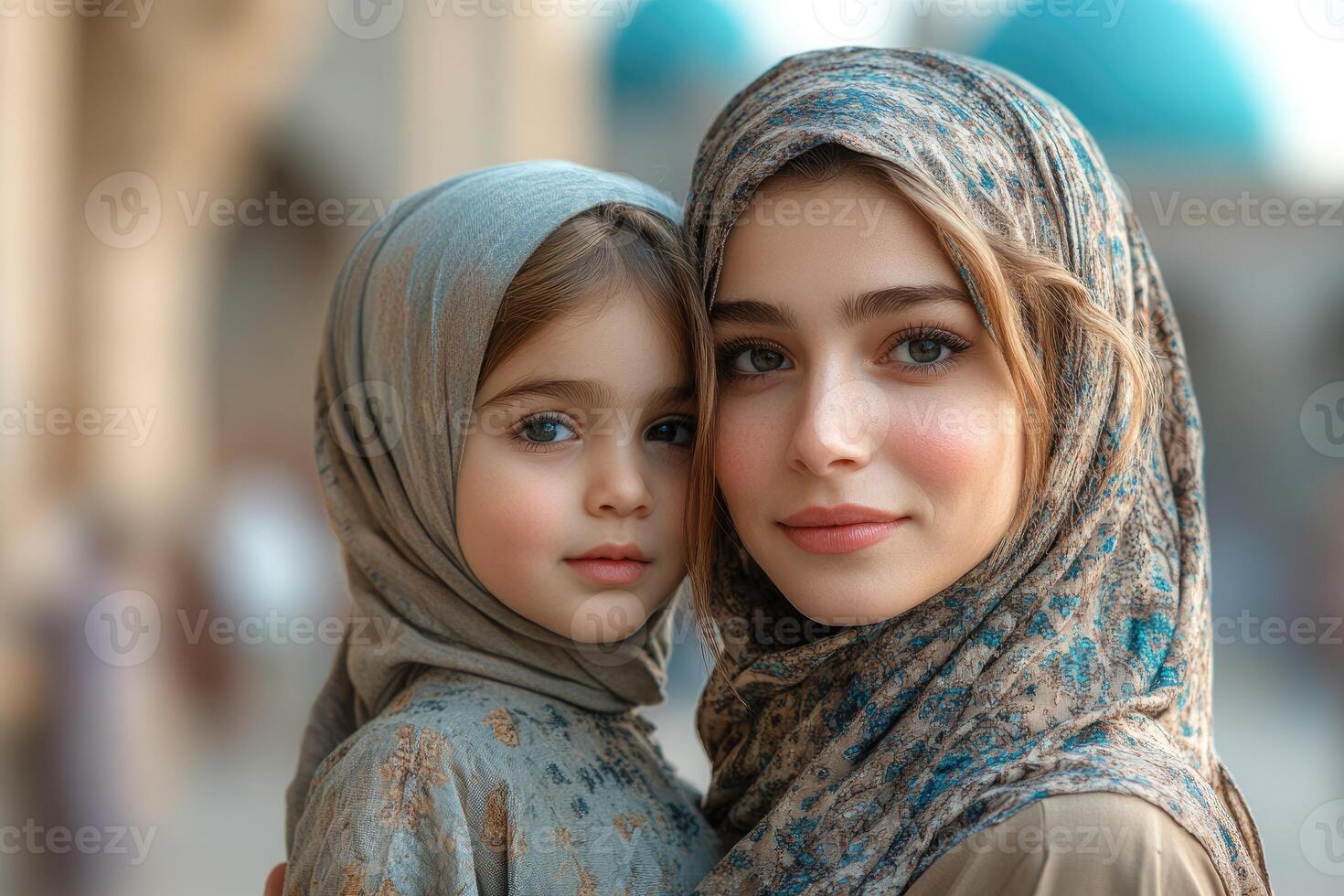 A woman and her daughter wearing hijab photo