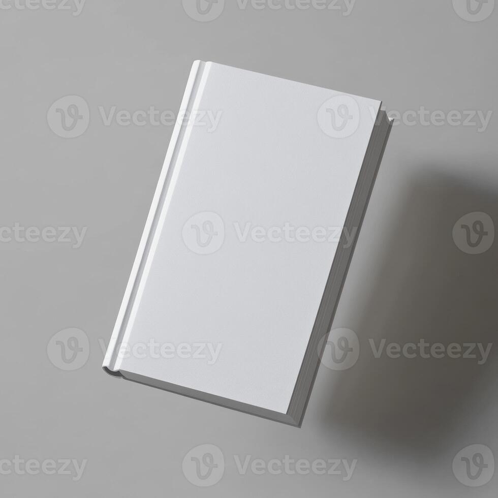 A blank white book floats against a gray background photo