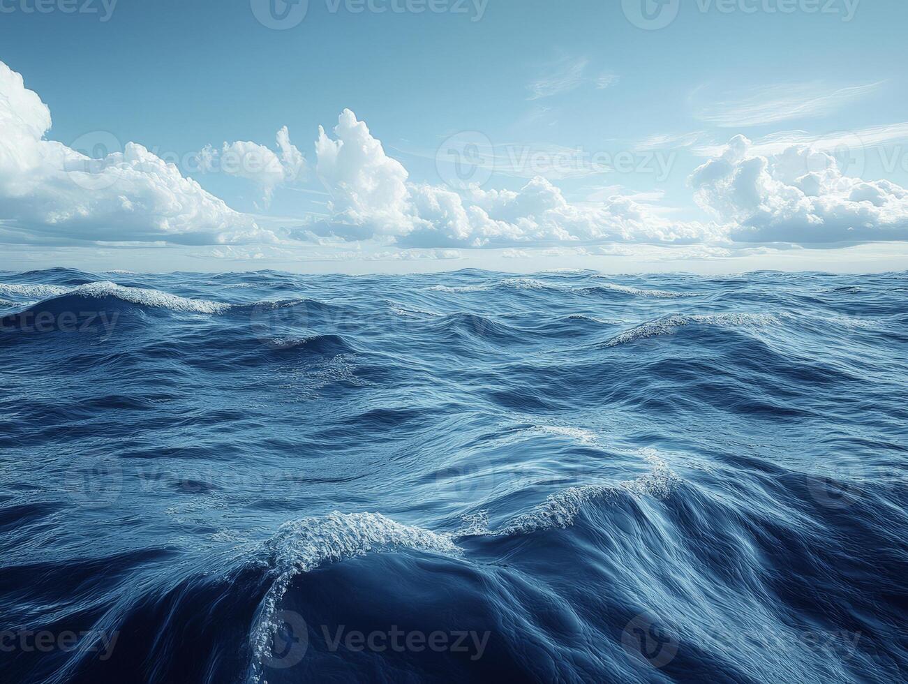 A serene view of ocean waves under a clear sky with fluffy clouds. photo