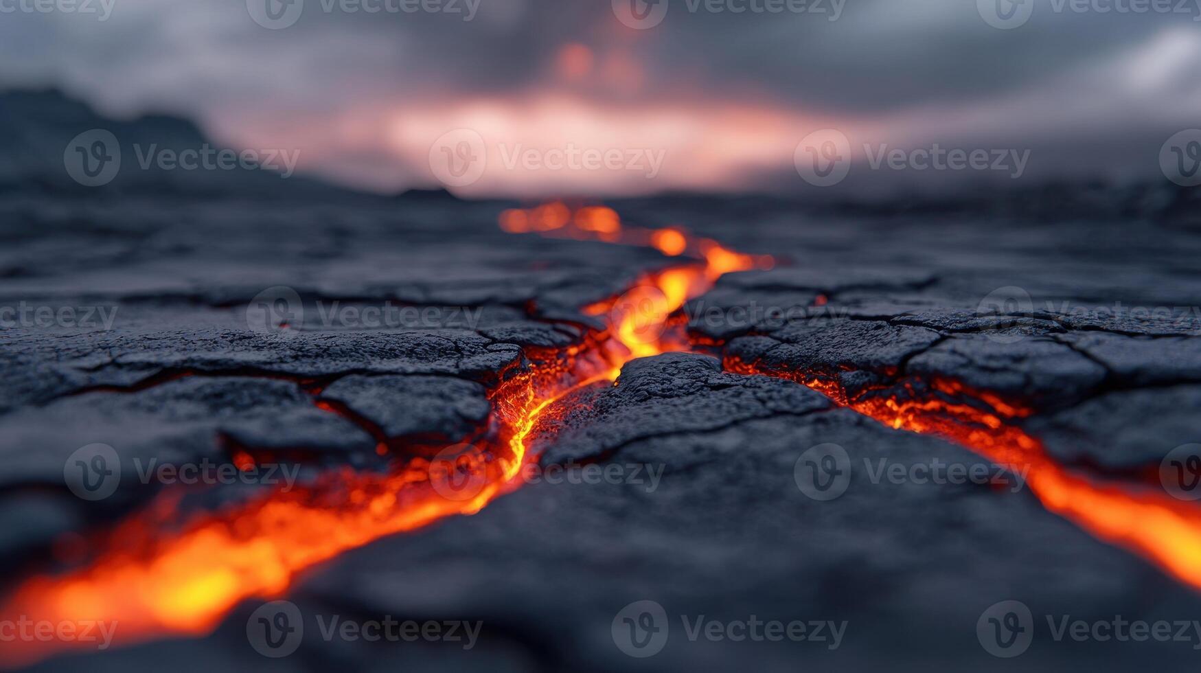 Glowing Lava Flowing Through Cracked Volcanic Rock at Sunset photo