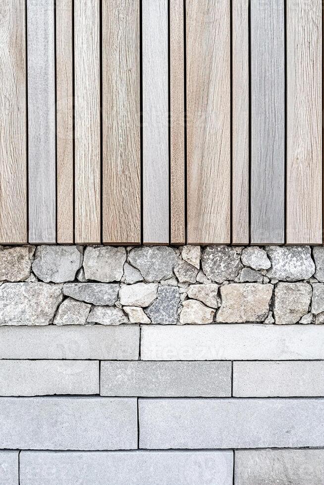 The backdrop showcases a harmonious blend of natural stone and wooden panels arranged in linear patterns. The muted tones create a soothing and elegant atmosphere ideal for various design projects photo
