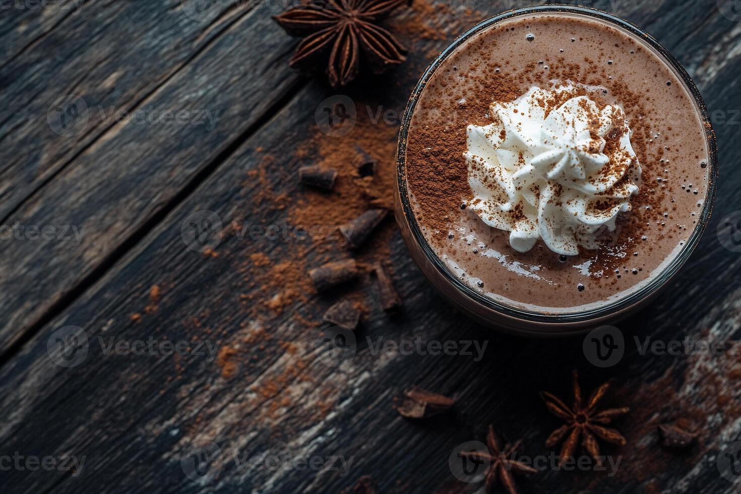 Indulge in this rich chocolate smoothie, beautifully topped with whipped cream, cocoa powder, and festive spices. Perfectly placed on a dark wooden table, it exudes warmth and comfort photo