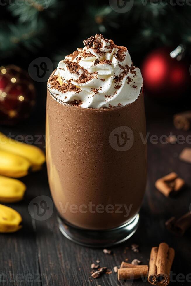 Rich chocolate smoothie served in a glass, adorned with whipped cream and cocoa powder, set on a dark wooden table with subtle holiday decorations, perfect for winter indulgence photo