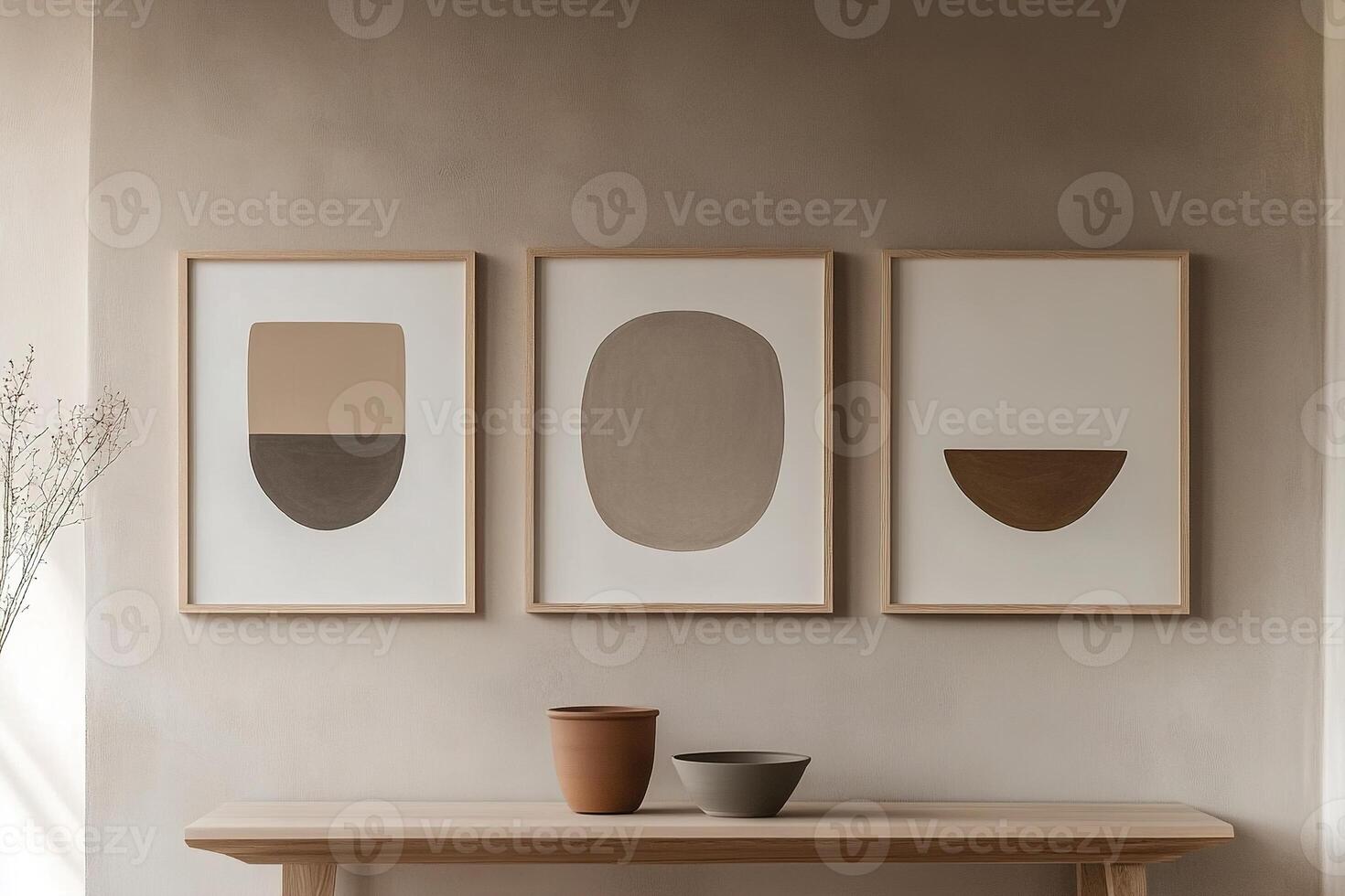 Three frames of abstract art in natural wood and white finishes hang symmetrically on a light gray wall. The sleek design offers ample space for text overlay, enhancing modern aesthetics photo
