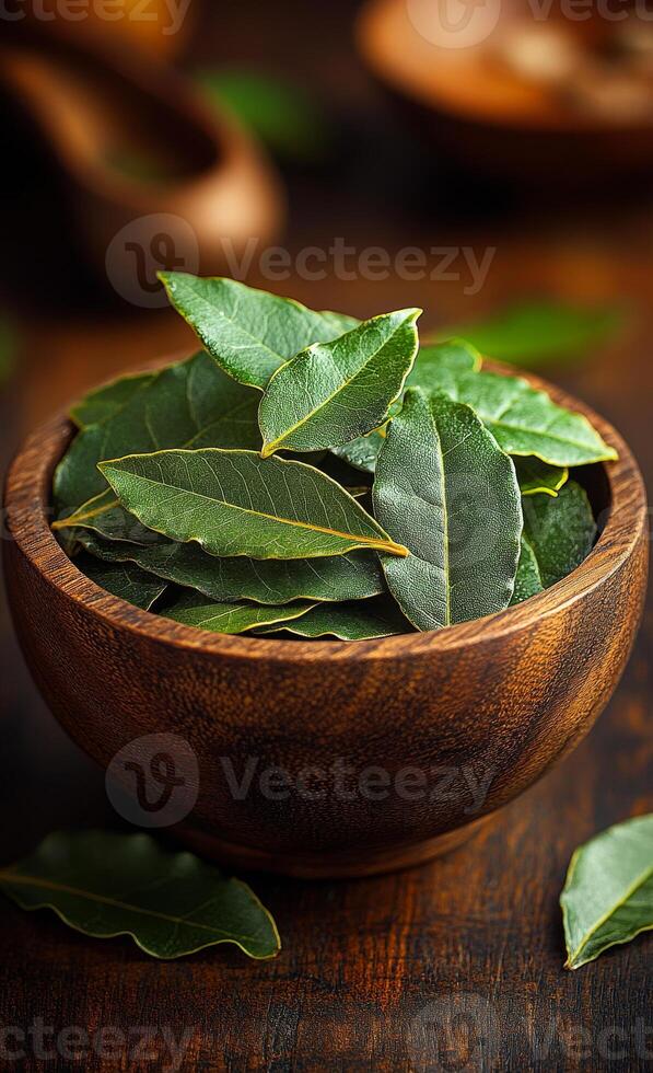 A bowl of fresh parsley leaves sits on a wooden table. The bowl is filled with a variety of green leaves, and the table is covered with a few other leaves. Concept of freshness and natural beauty photo