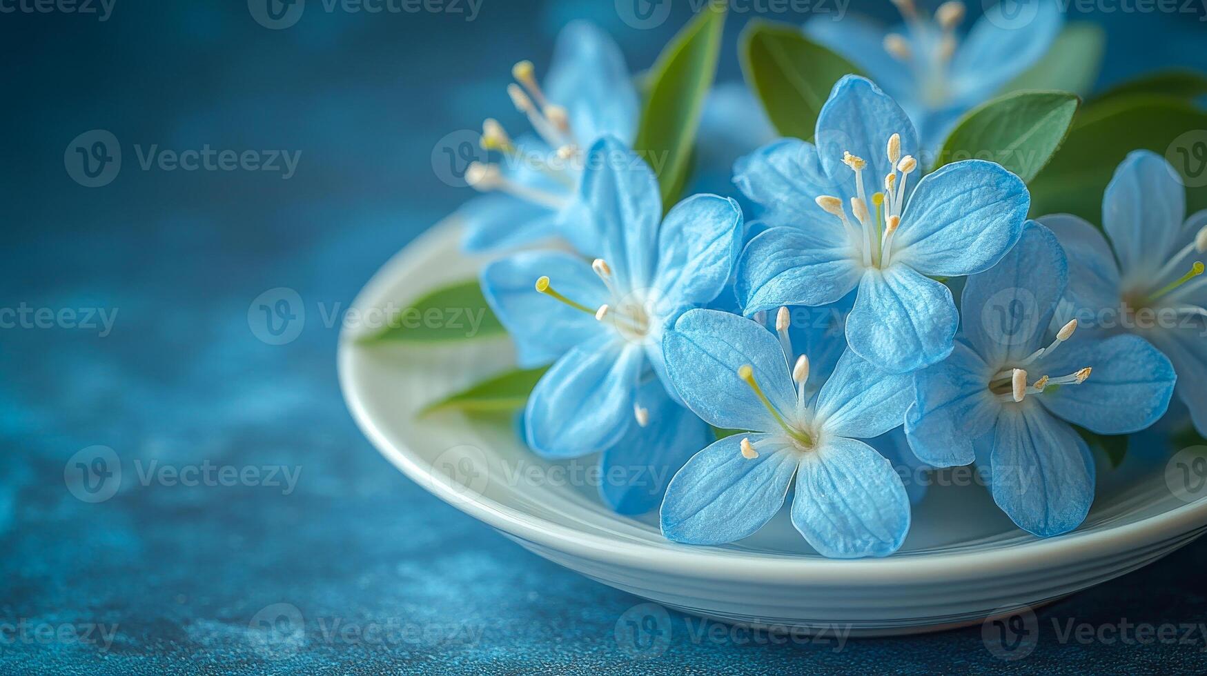 A white plate with blue flowers on it. The flowers are in a vase and are arranged in a way that they look like they are floating. The blue color of the flowers gives a sense of calmness and serenity photo