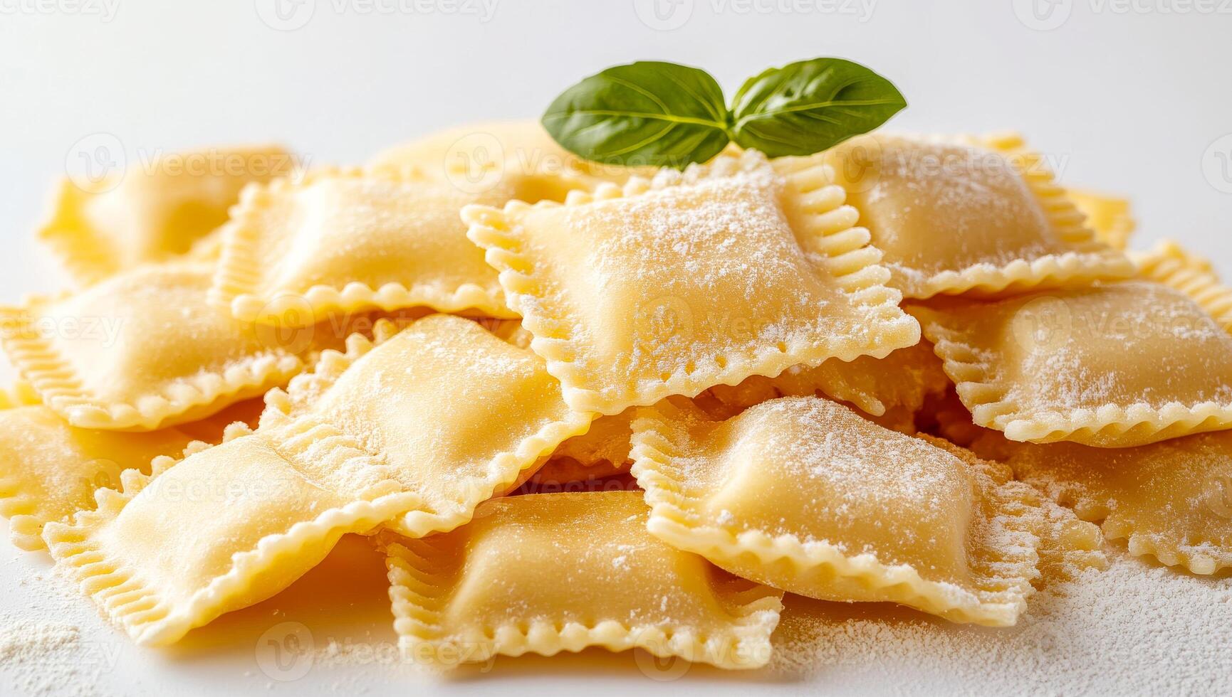 A stack of pasta with a green leaf on top. The pasta is made of wheat and is white in color. The leaf is fresh and green, and it is placed on top of the pasta. The pasta is arranged in a neat pile photo