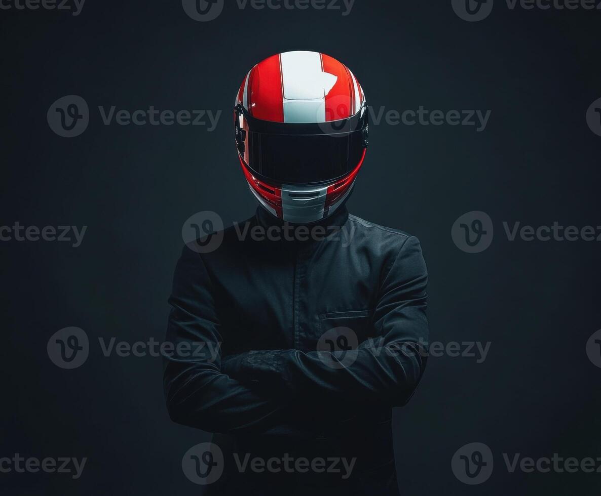 Red and white helmeted figure in dark attire poses confidently in low light setting photo