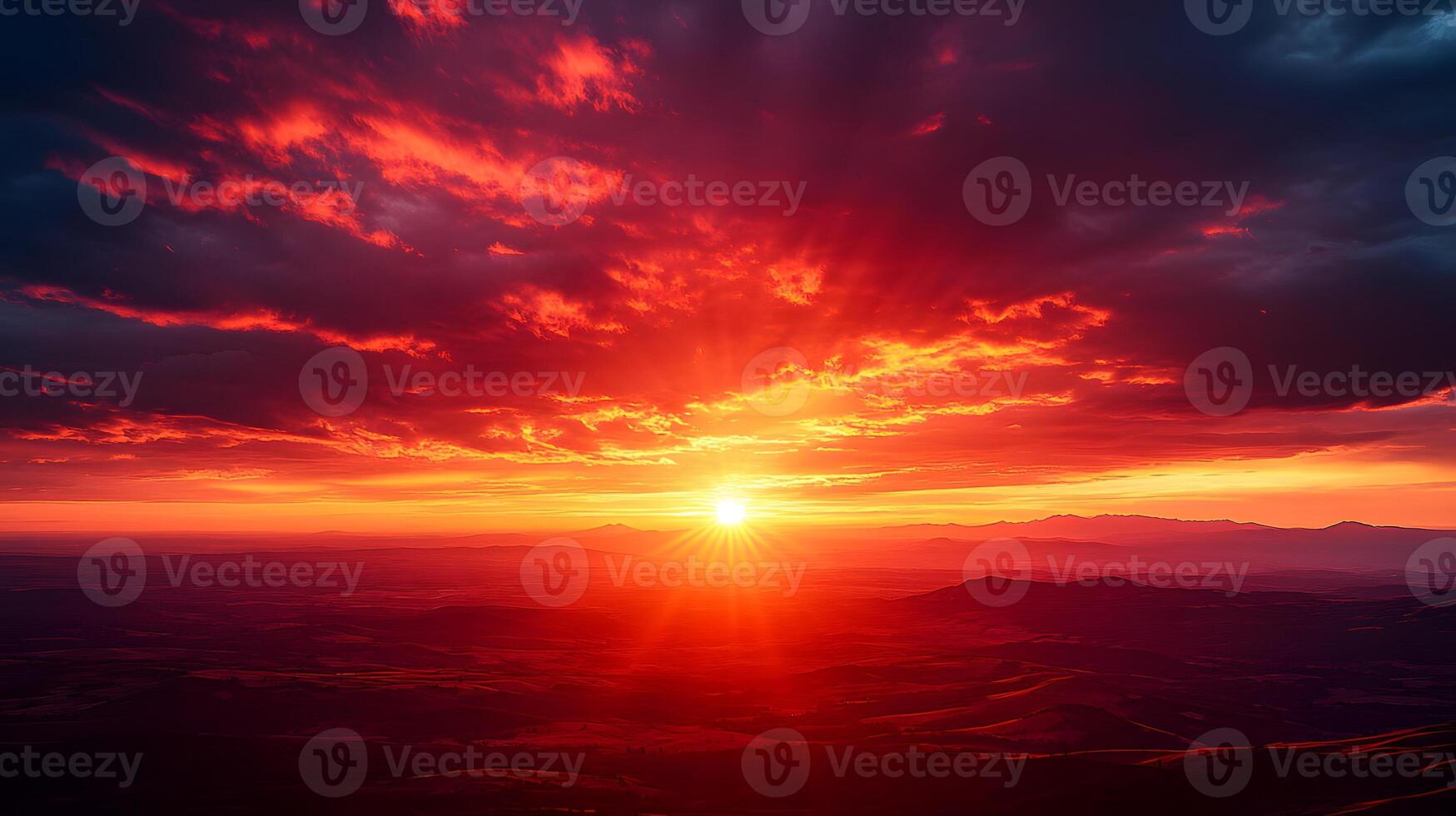 Dramatic sunset displays vibrant orange and deep red gradient with dark crimson clouds, creating majestic dusk horizon and ethereal evening glow in tranquil landscape composition. dramatic photo