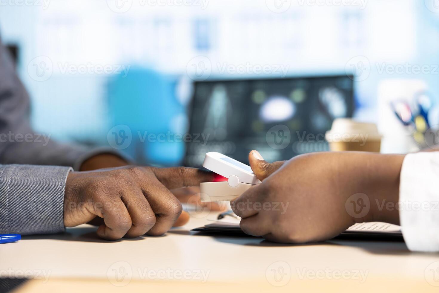 Medic expert checking oxygen saturation and pulse rate using oximeter during routine checkup, consulting her male patient with modern medical equipment. Vital signs measurement. photo