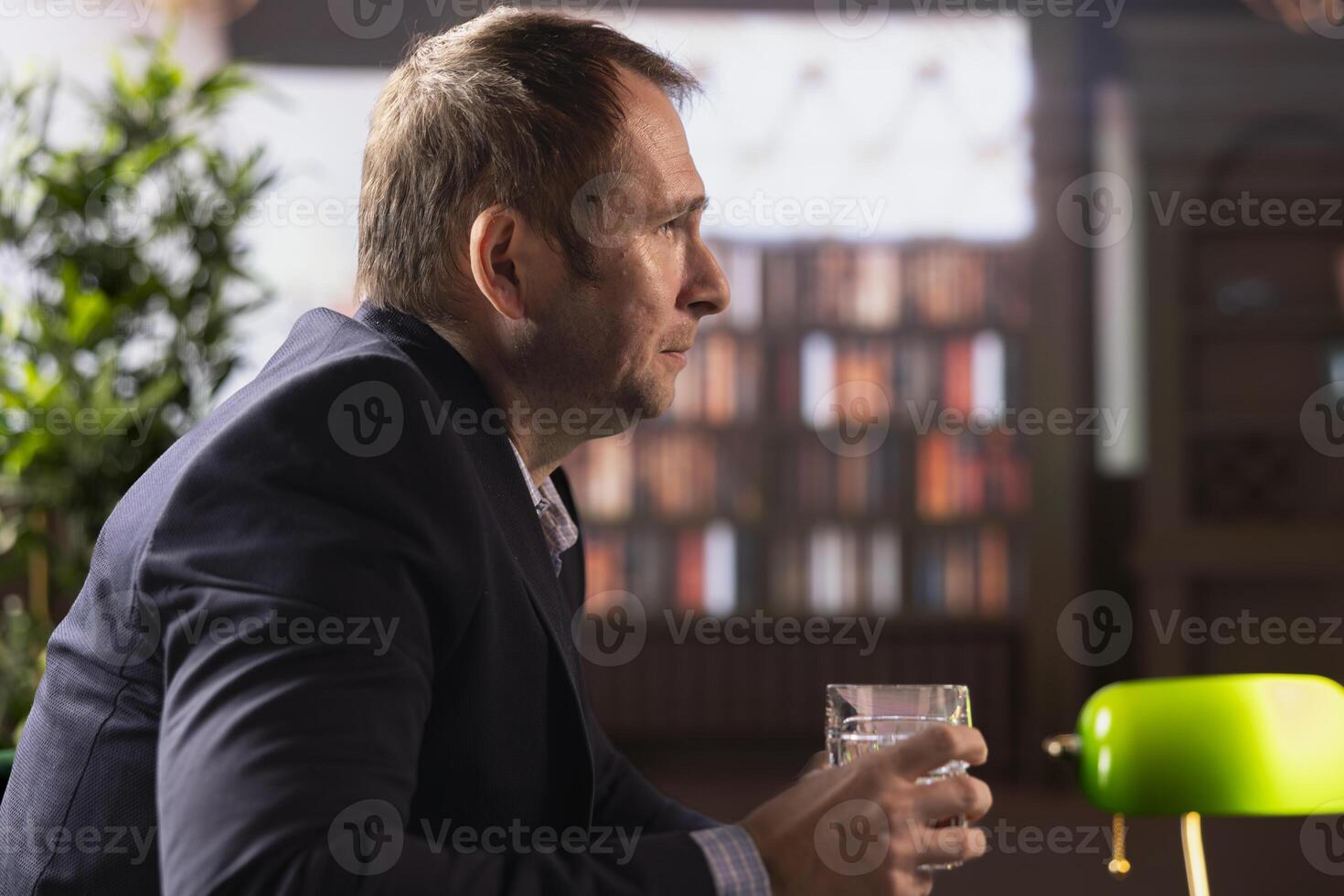 Professional billionaires engaged in an intense discussion, sipping scotch in an upper class social club, exemplifying partnership and strategic decision making. Old money gentlemen negotiating. photo