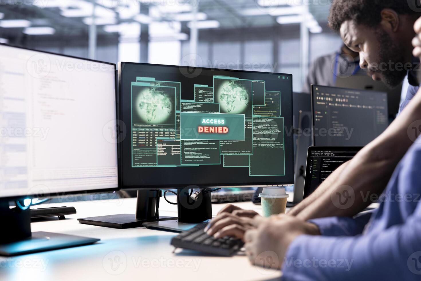 Computer scientist in data center getting access denied notification on PC screen, trying to access server files after they were locked by hacker using ransomware, requesting help from IT expert photo