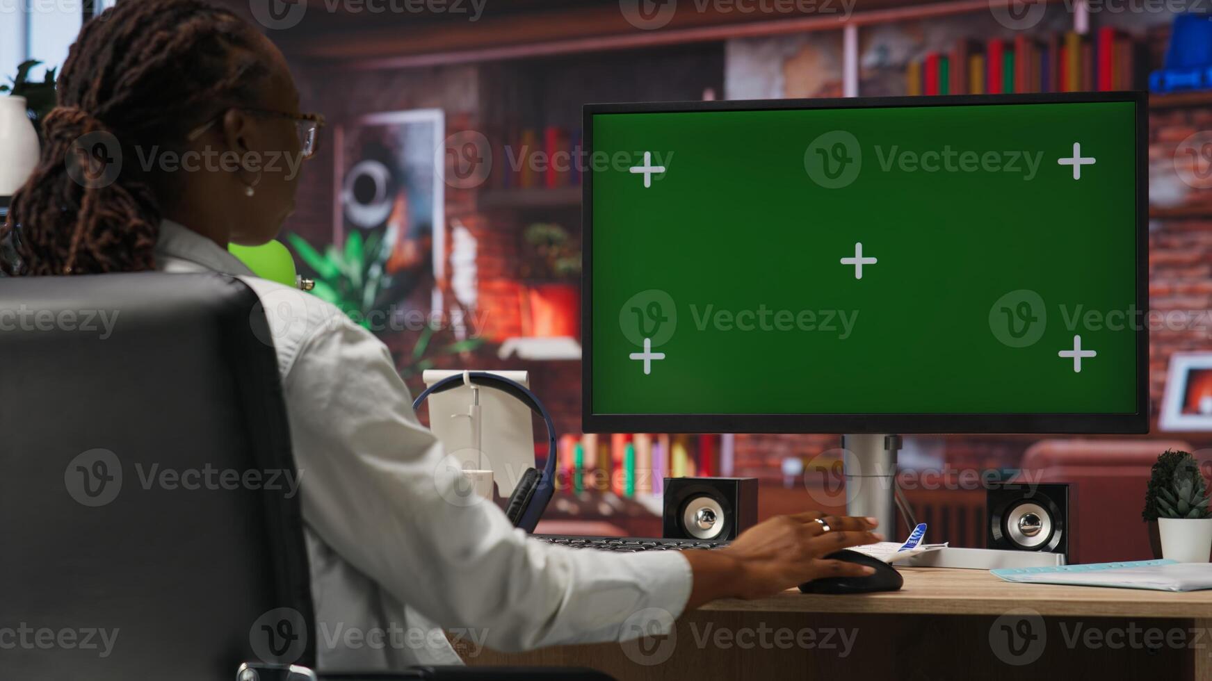 Teleworker using green screen PC in home office to write emails. Remote worker typing on mockup computer keyboard, composing documents in order to deliver finalized project paperwork, camera B photo