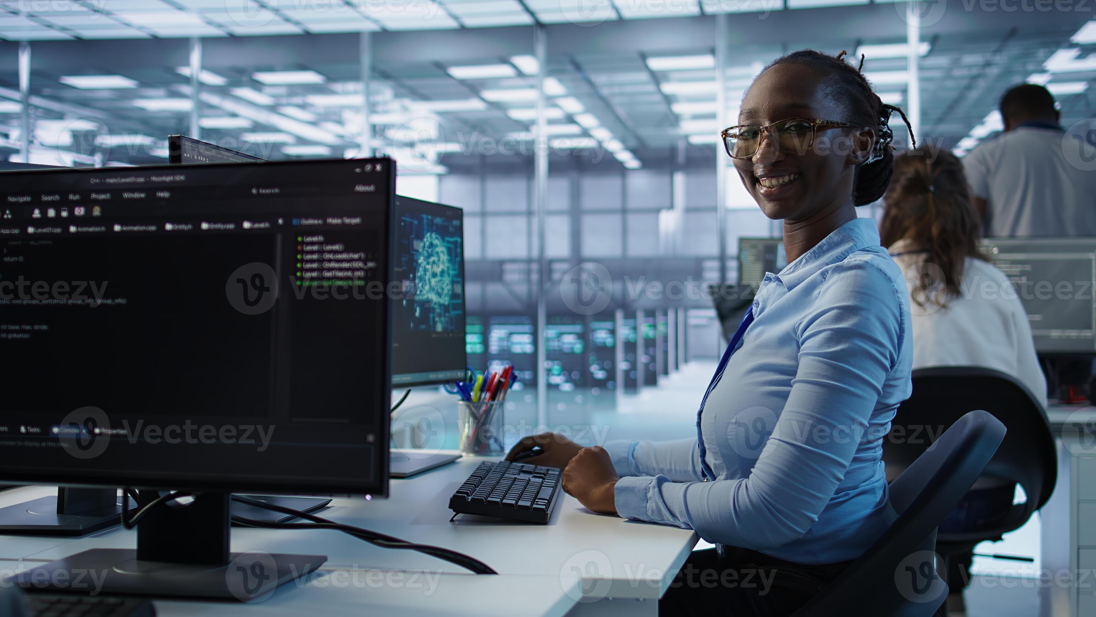 Portrait of happy computer scientist programming in AI data center used ...