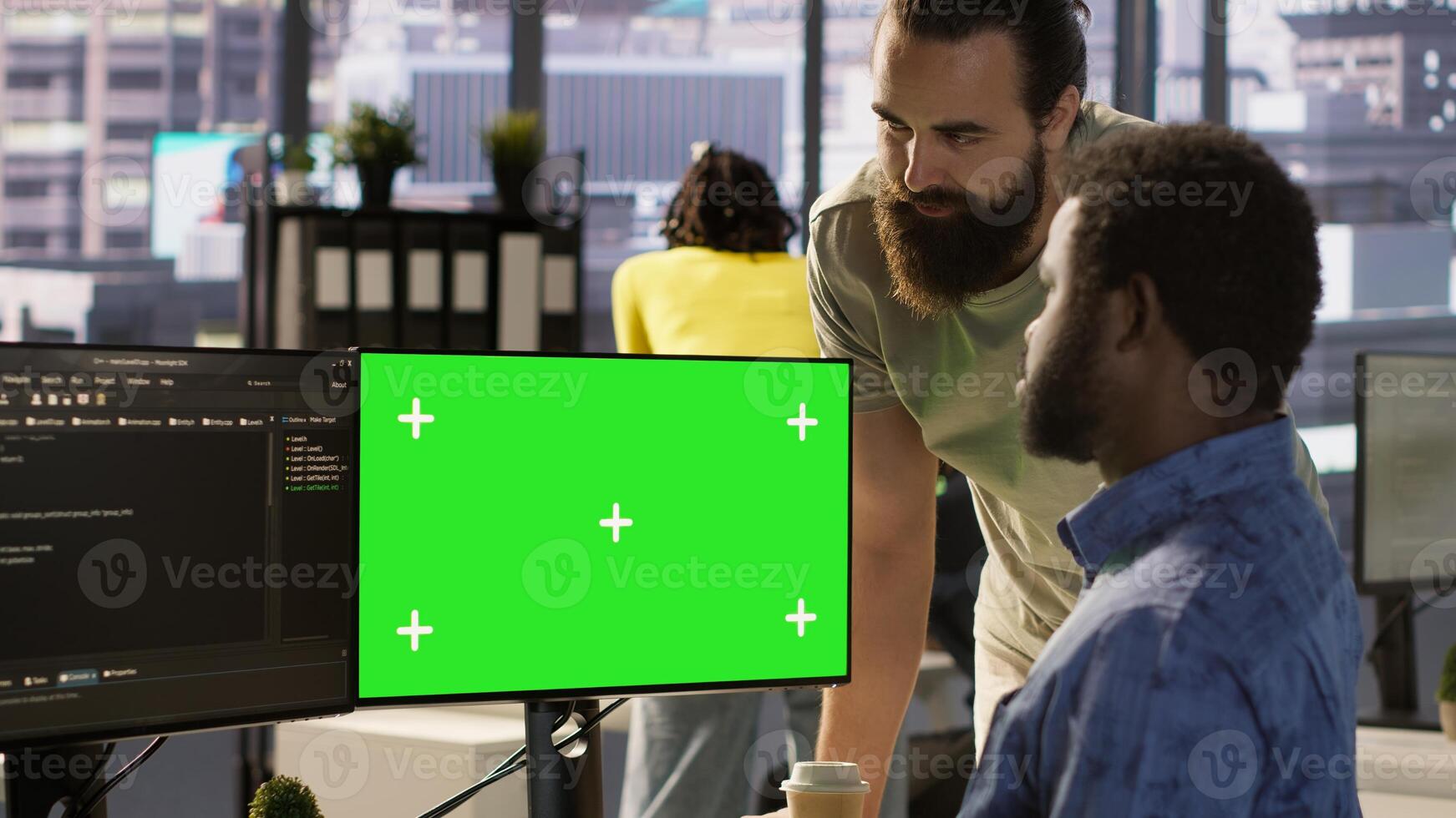 Developer using mockup PC, being assisted by colleague to fix applications issues, dealing with databases and server configuration. Team of IT workers using green screen computer, camera A photo
