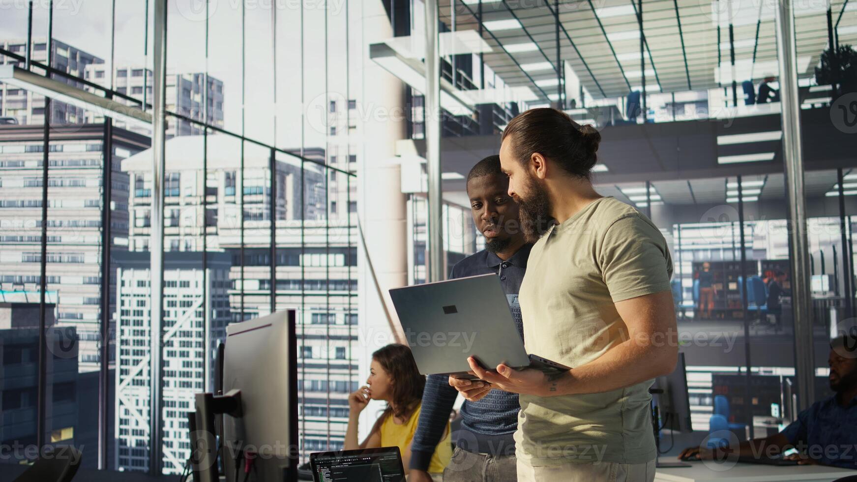 Programmer and colleague conducting experiments and tests to optimize machine learning models for performance and accuracy. IT staff members in office analyzing and interpreting complex data, camera B photo