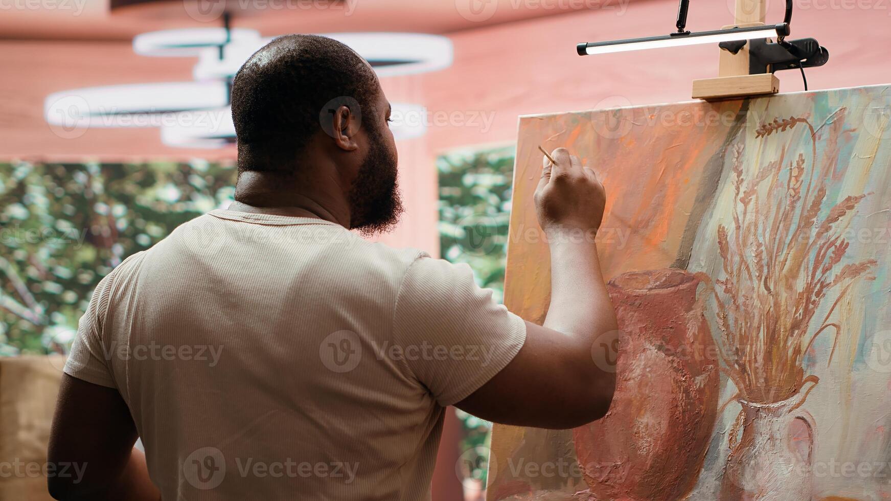 In a creative workshop, artist mixes pigments to achieve the perfect dye shade. Using professional art supplies to create a beautiful masterpiece on canvas, quality time in atelier. Camera A. photo