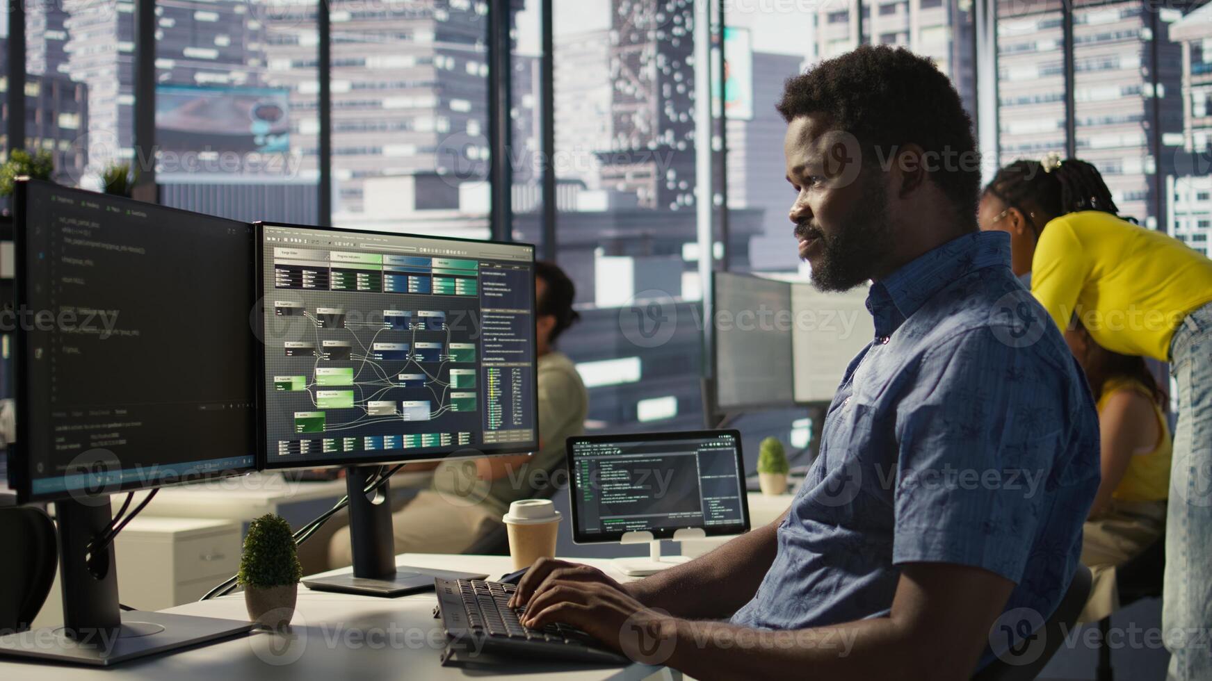 System administrator at work creating machine learning models that can process and analyze data. Close up of african american IT expert programming in office using PC, camera B photo