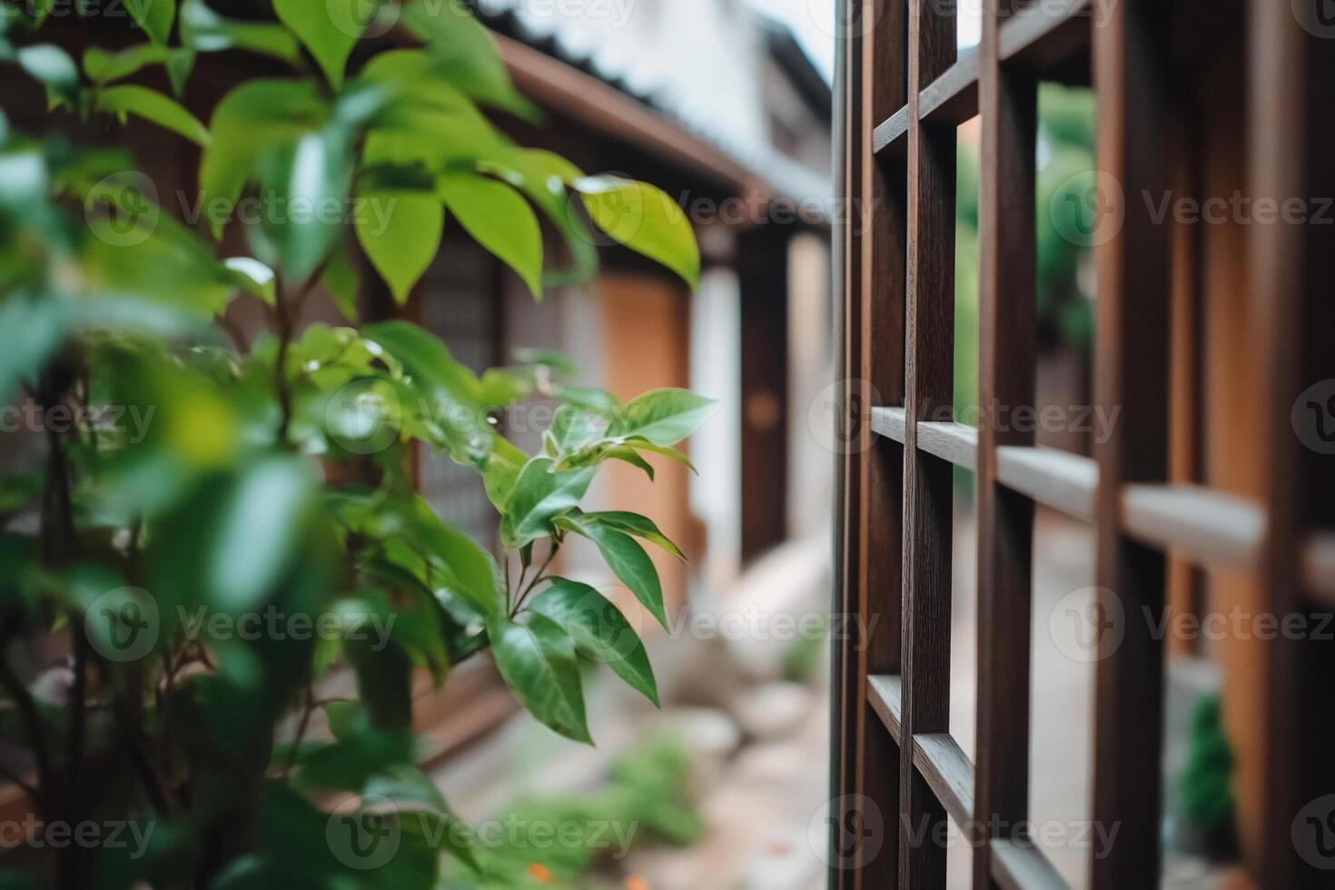 A serene view of a traditional Japanese garden through wooden lattice. photo