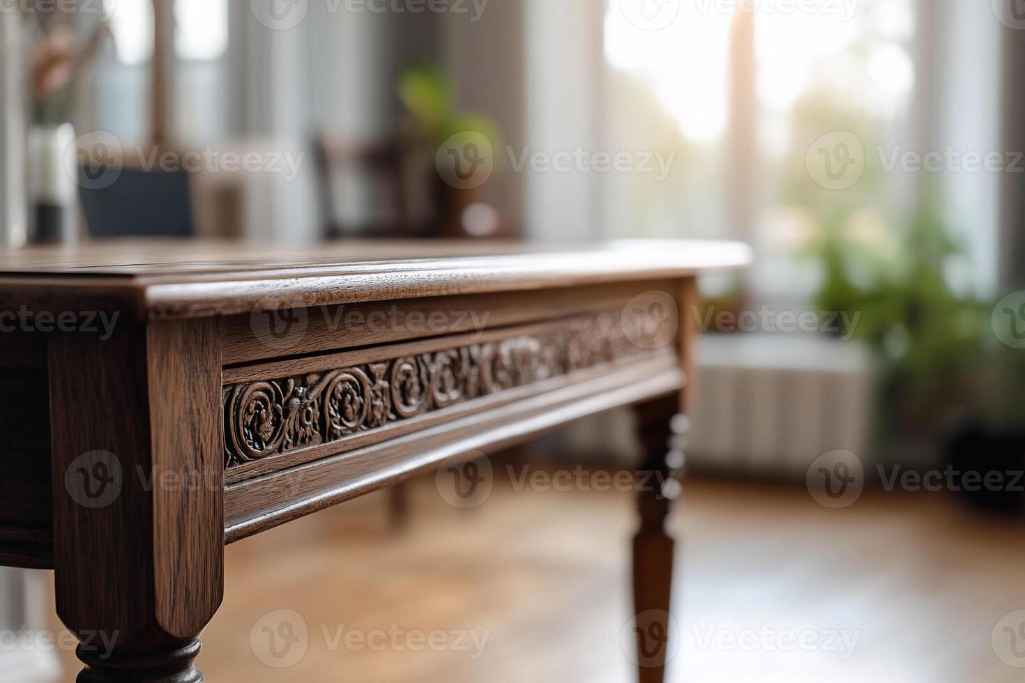 A close-up of an intricately carved wooden table in a sunlit room. photo