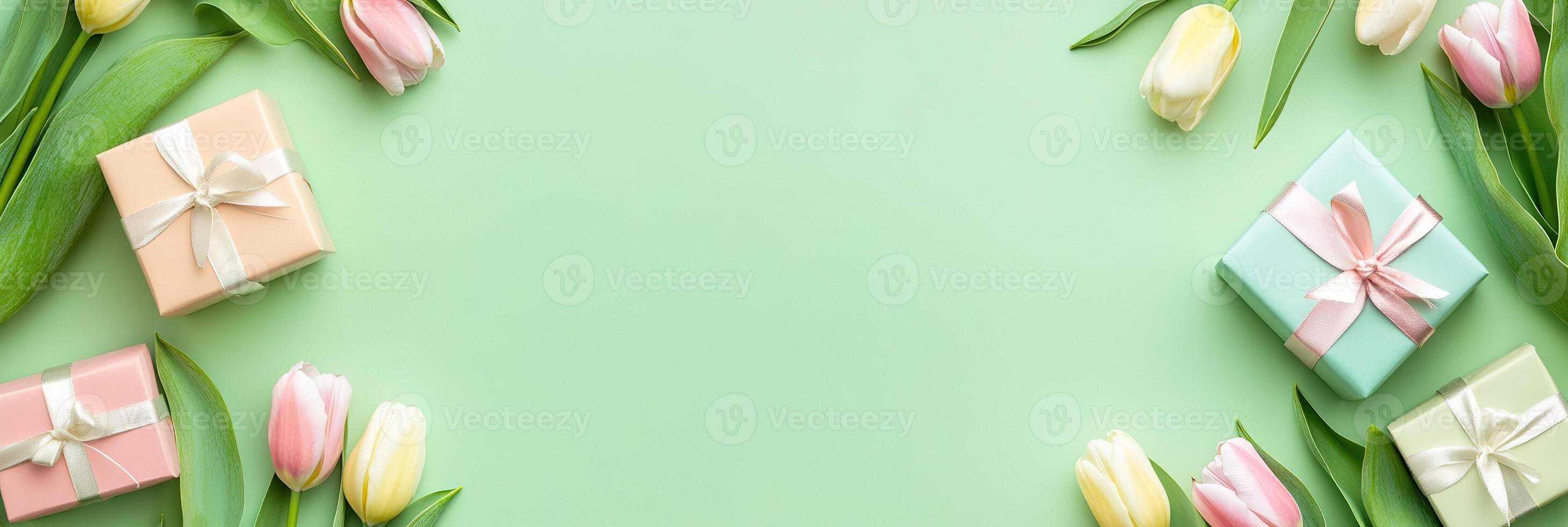 banner delicate tulips flowers border frame with small gift boxes on light green background top view, beautiful floral template with copy space photo