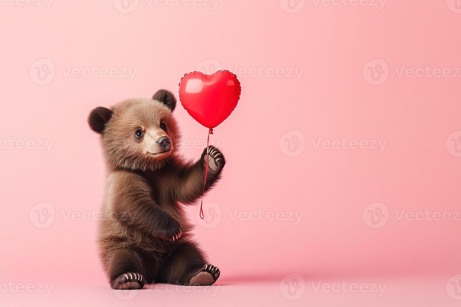lovely brown bear cub holding red heart-shaped balloons on pastel pink background with copy space, romantic valentines day postcard photo