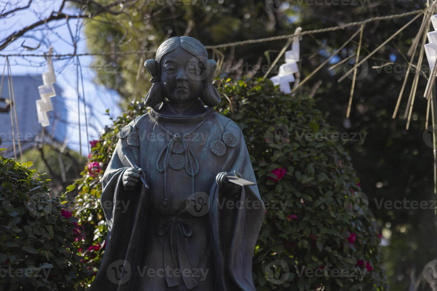 A guardian statue of man at Kameido Tenjin shrine photo