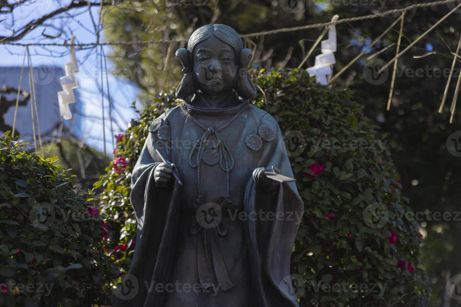 A guardian statue of man at Kameido Tenjin shrine photo