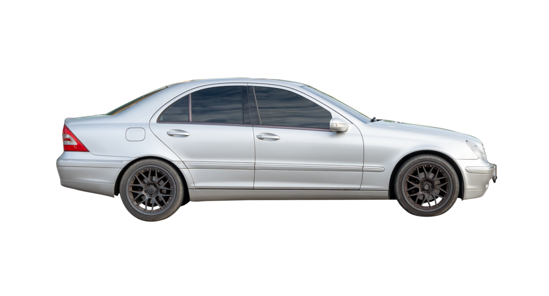 An old model of silver sedan car isolated with clipping path in file format png