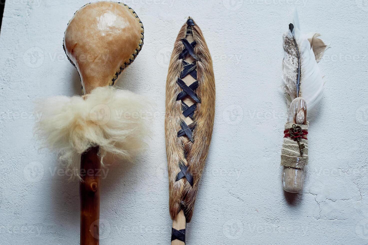 Shamanic objects. Tambourine beaters, a speaker's stick, noise makers. Ethnic Items photo