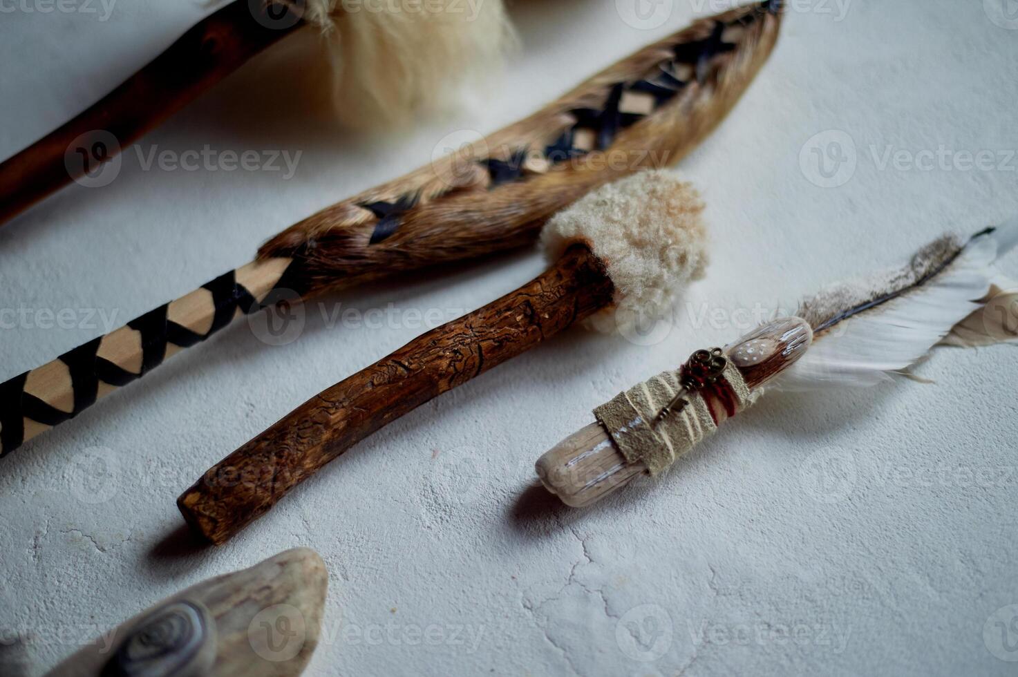 Shamanic objects. Tambourine beaters, a speaker's stick, noise makers. Ethnic Items photo