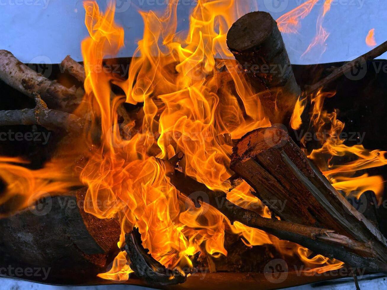 A burning fire in a brazier photo
