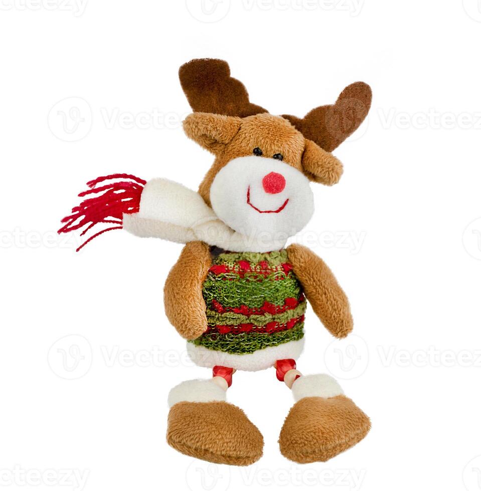 A toy deer with a scarf. Soft children's Christmas toy. Plush fawn. Cheerful smiling deer. photo
