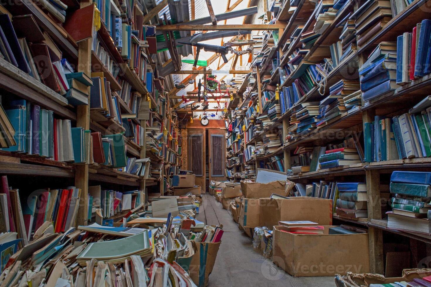 An old abandoned library. Book background. Books on the bookshelf. Knowledge in paper form photo