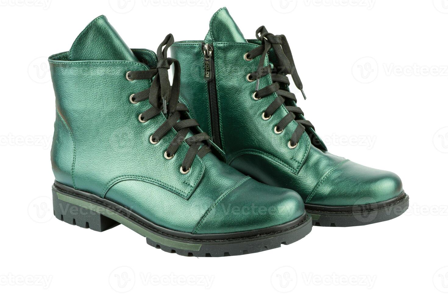 Green leather shoesisolated on white background. Winter and spring off-season boots. Stylish boot. Close-up. Laces, tractor sole. Casual style. Copy space. Pearlescent fashionable color. photo