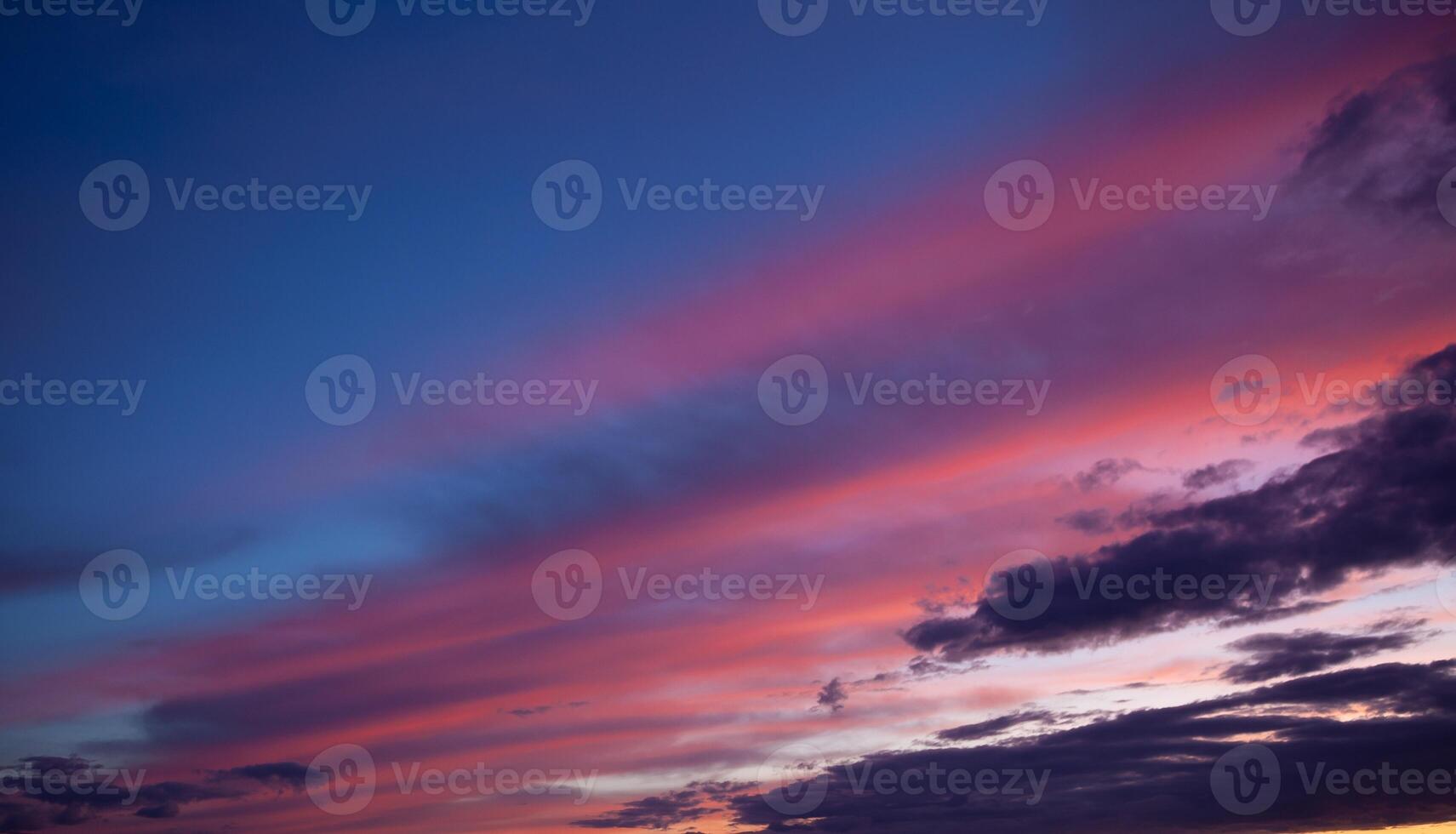 Multi-colored clouds on the dramatic sky. Consumption and sunset clouds. Natural landscape photo