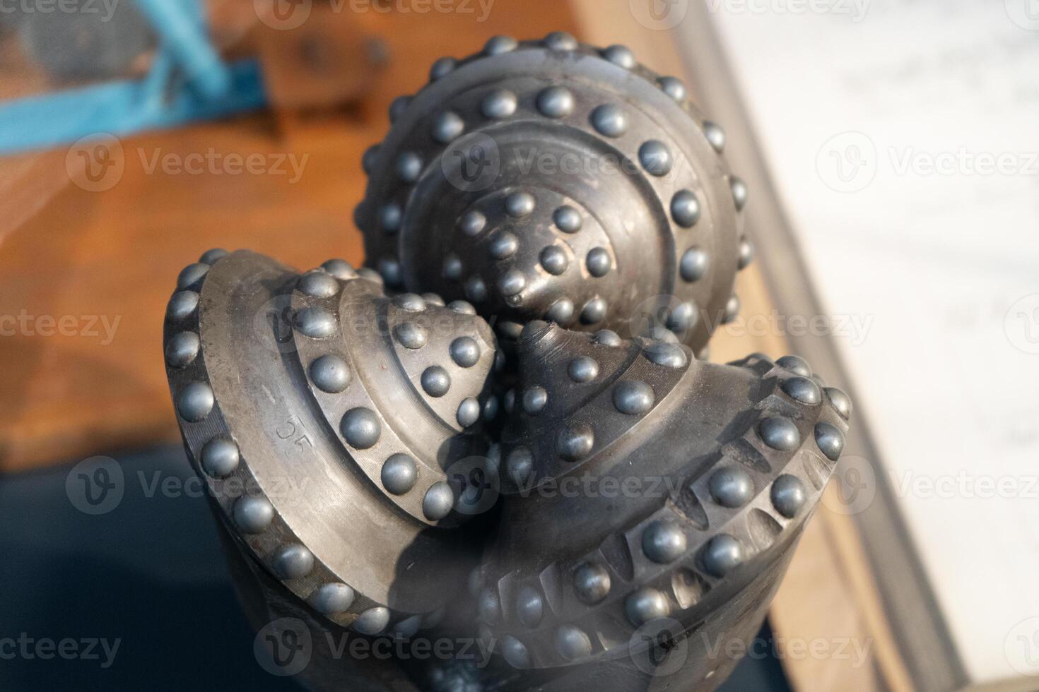 Drill bits. Perforator button for water wells. Tricone bit. Equipment for water and coal wells. Drilling three cone photo