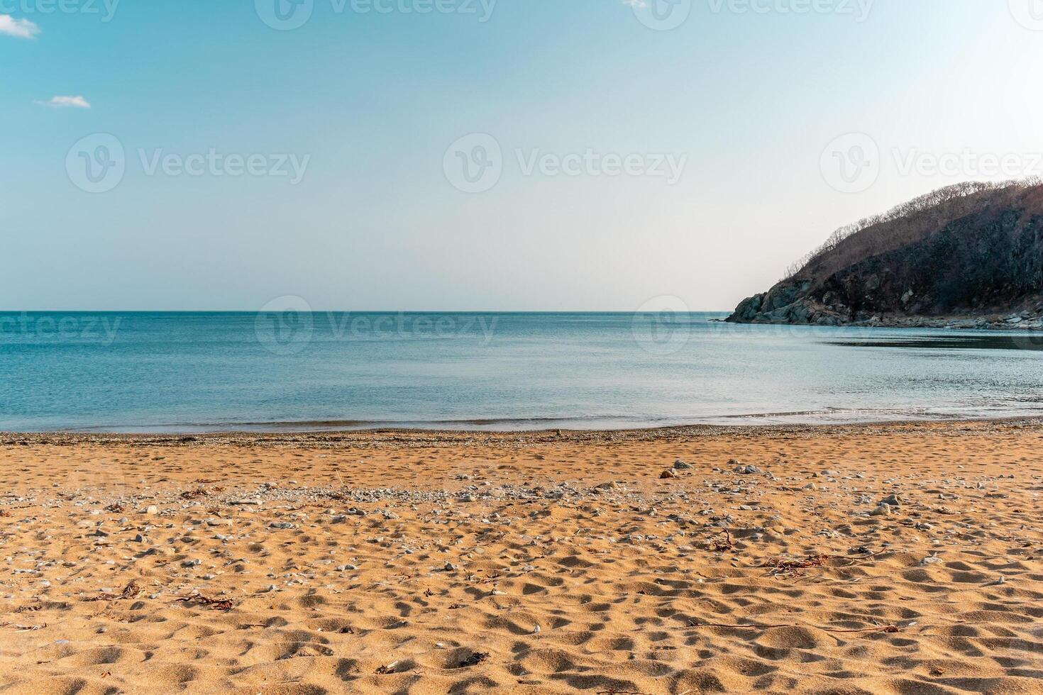 View of the vastness of the Pacific Ocean from the high seashore.. High cliffs on the shore of the Pacific Ocean. photo