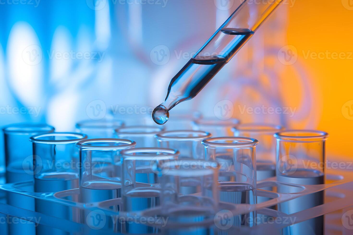 Pipette drops liquid into test tubes, symbolizing precision and scientific innovation photo