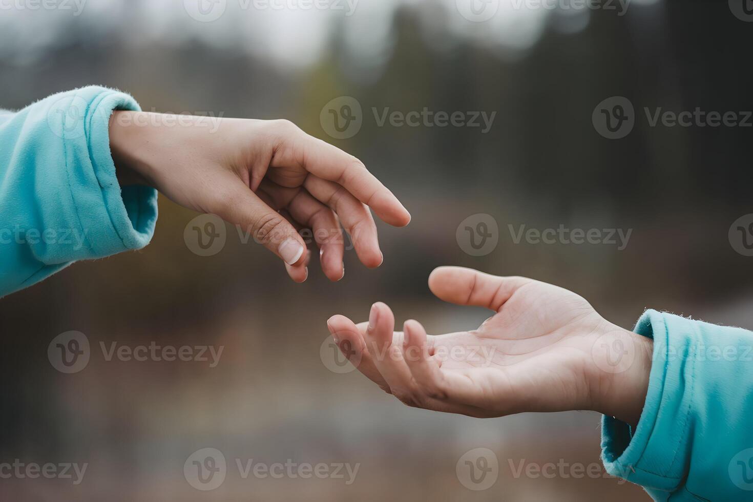 Hands reaching together represent mutual support and connection photo