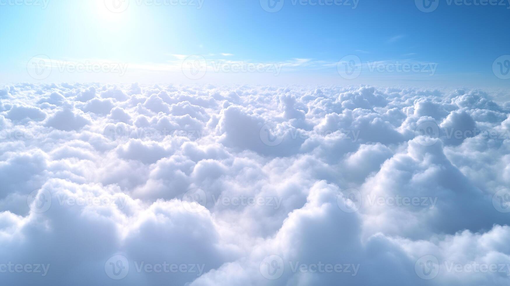 Serene Aerial View of White Fluffy Clouds Against a Bright Blue Sunlit Sky photo