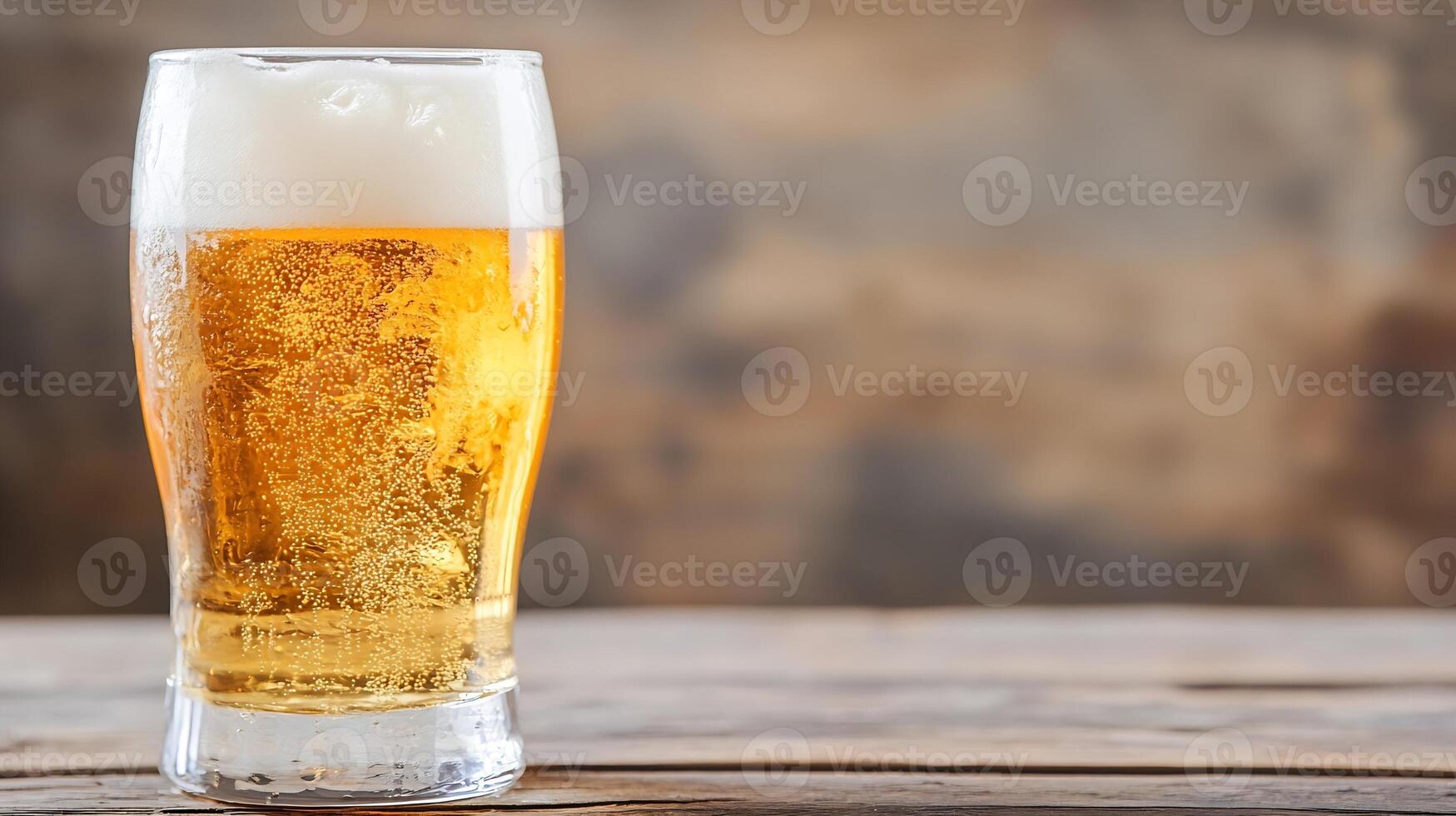Cold Refreshing Glass of Beer on Rustic Wooden Table with Natural Background photo