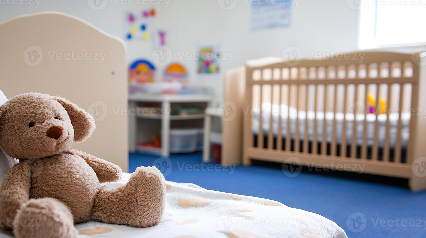 Cuddly teddy bear in a modern nursery room with crib and playful wall decor photo